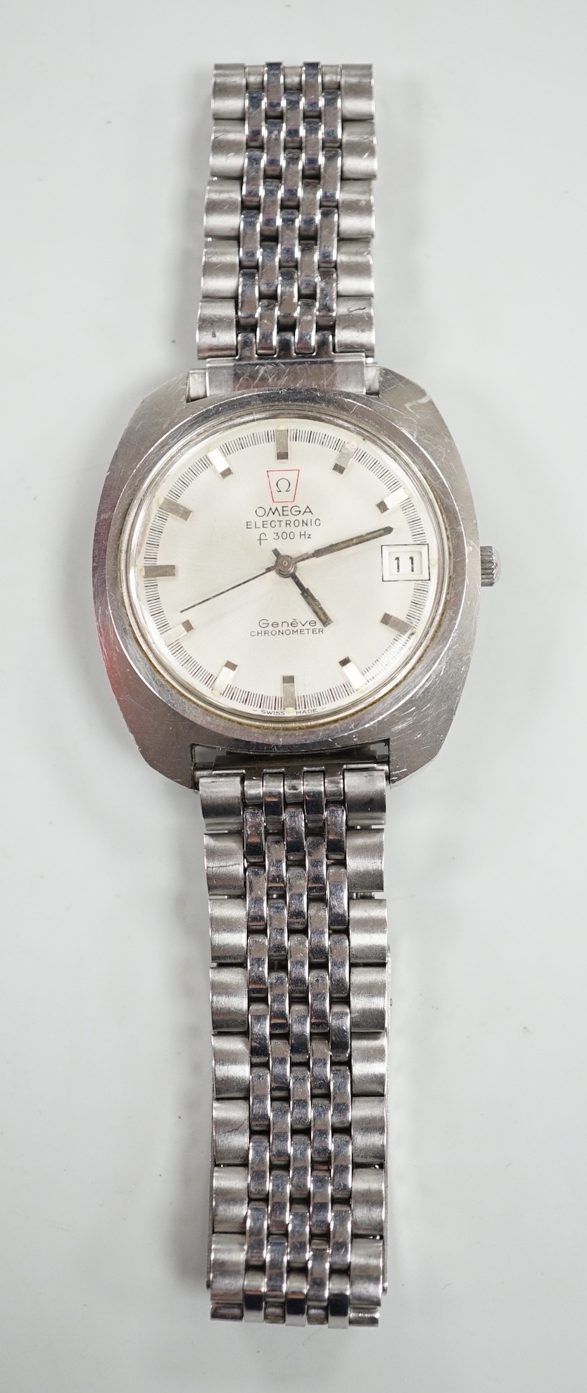 A gentleman's 1970's? stainless steel Omega Electronic wrist watch, on associated steel bracelet, a case diameter 38mm, box no papers.